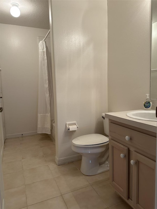 full bathroom featuring vanity, a textured ceiling, shower / bathtub combination with curtain, tile patterned flooring, and toilet