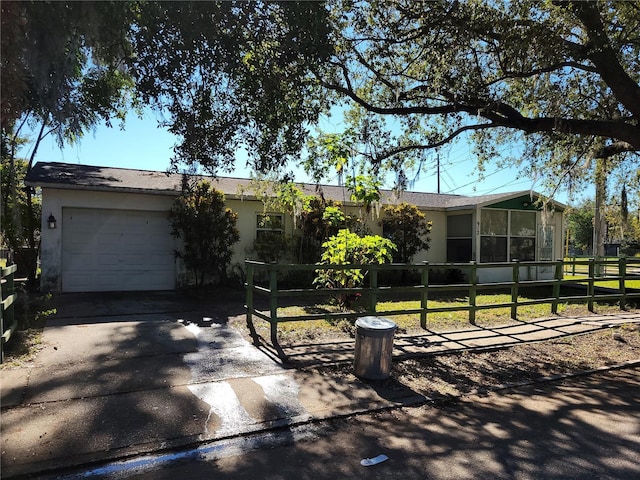 view of front of home with a garage and a front yard