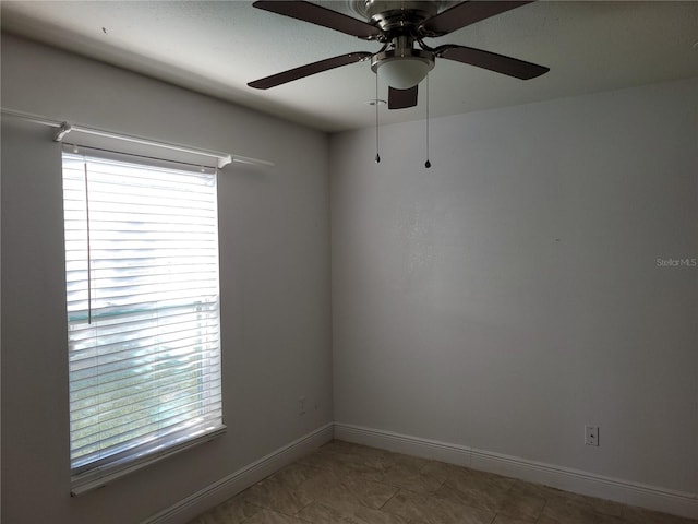 unfurnished room featuring ceiling fan