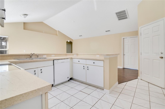 kitchen with kitchen peninsula, white cabinetry, sink, and white dishwasher