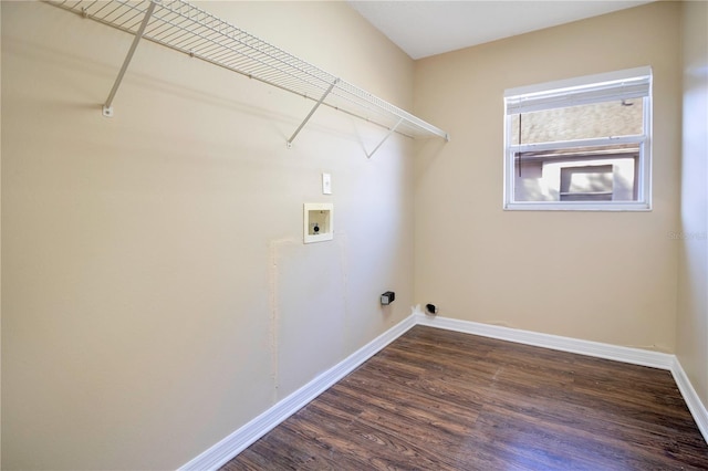 laundry area with hookup for a washing machine and dark wood-type flooring