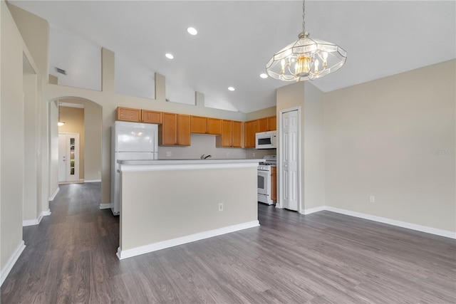 kitchen featuring hanging light fixtures, high vaulted ceiling, dark hardwood / wood-style floors, white appliances, and a kitchen island