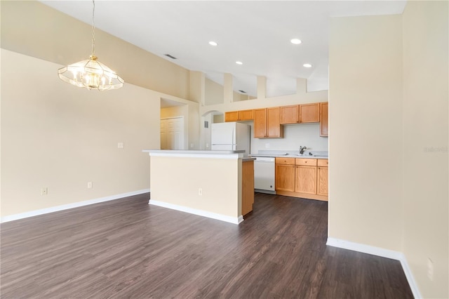 kitchen featuring pendant lighting, white appliances, high vaulted ceiling, dark hardwood / wood-style floors, and a kitchen island