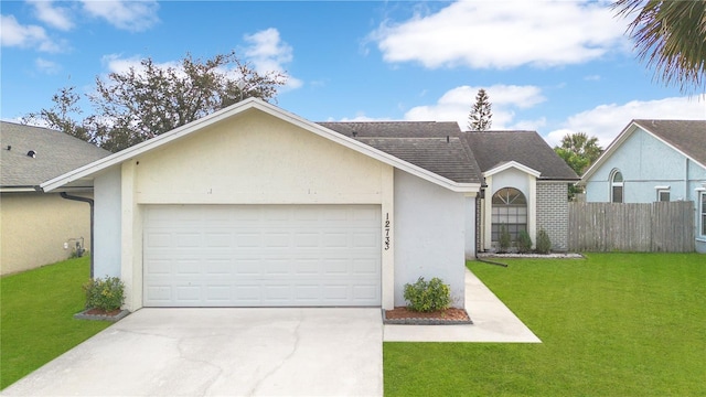 ranch-style home with a front yard and a garage