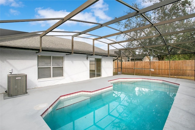 view of swimming pool featuring cooling unit and a lanai