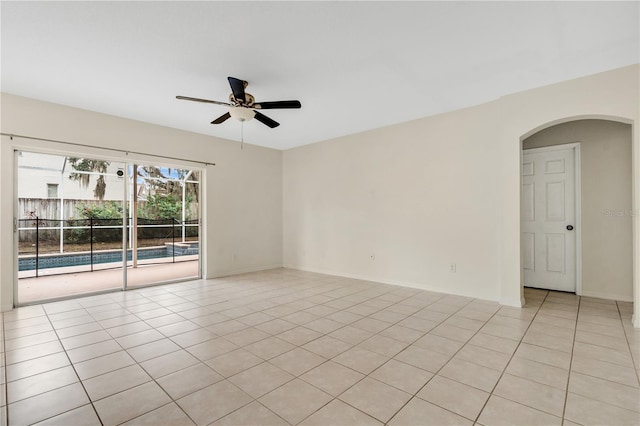 unfurnished room with ceiling fan and light tile patterned flooring