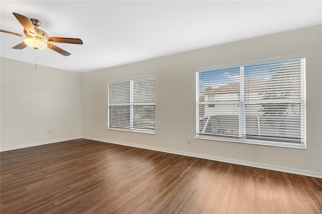 unfurnished room with ceiling fan and wood-type flooring