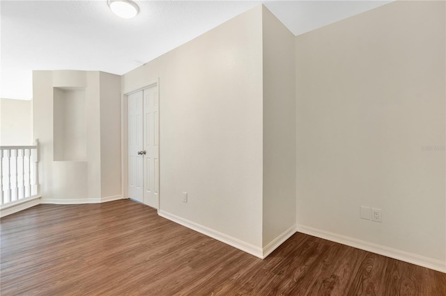 spare room with hardwood / wood-style flooring