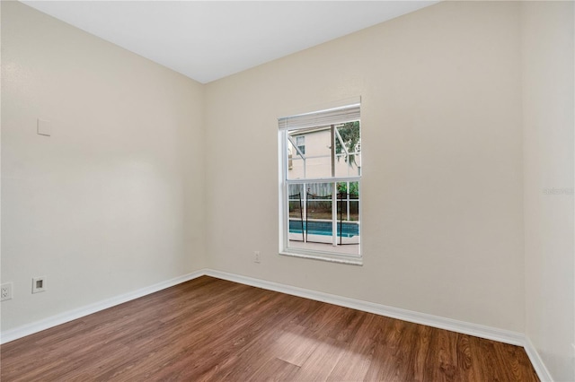 unfurnished room featuring hardwood / wood-style flooring