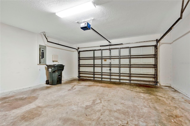 garage featuring a garage door opener and electric panel