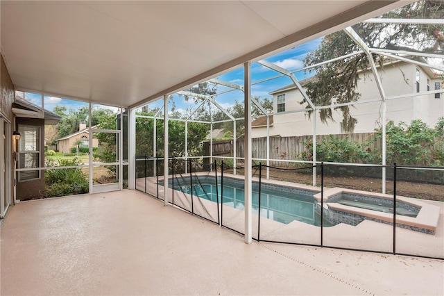 view of pool featuring a patio area, a lanai, and an in ground hot tub