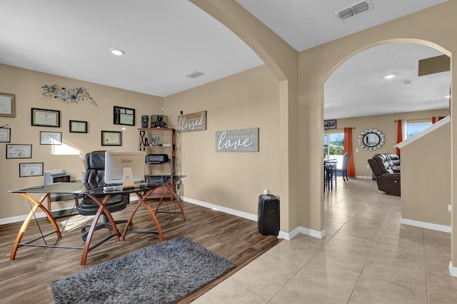 office area with light tile patterned flooring