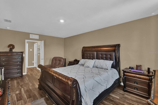 bedroom featuring dark hardwood / wood-style floors