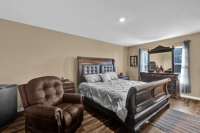 bedroom with dark wood-type flooring