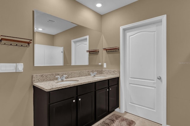 bathroom featuring tile patterned floors and vanity