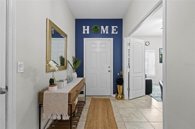 entryway featuring light tile patterned floors