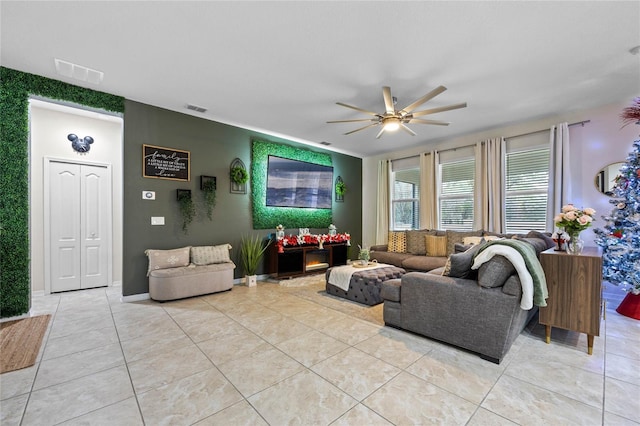 living room featuring ceiling fan and light tile patterned flooring