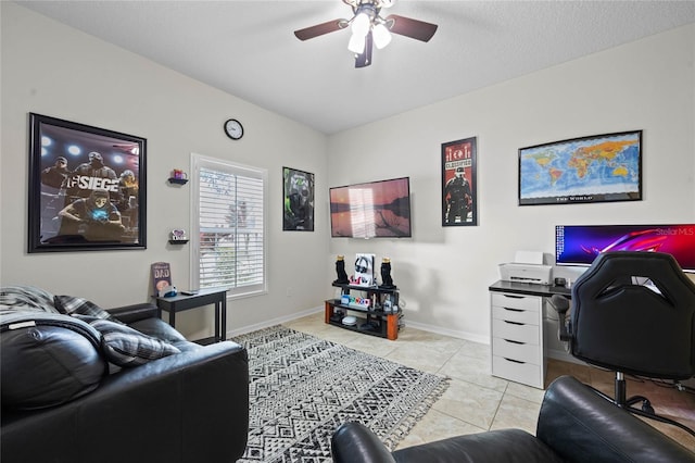 home office featuring ceiling fan and light tile patterned floors