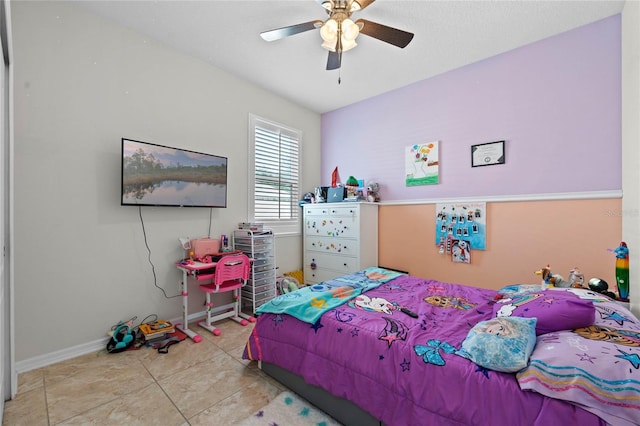 bedroom with light tile patterned floors and ceiling fan