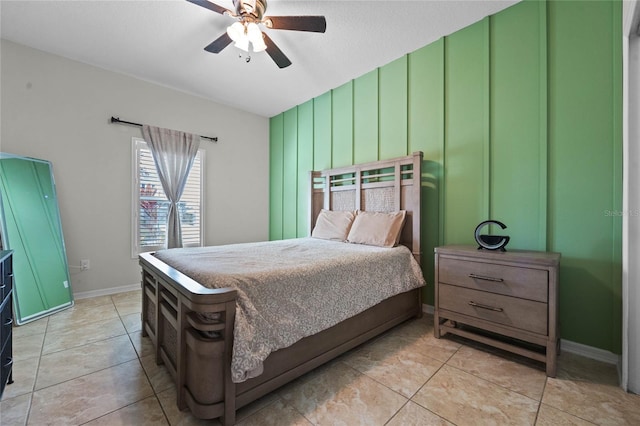 bedroom featuring light tile patterned floors and ceiling fan