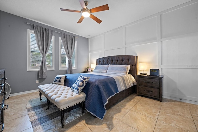 tiled bedroom featuring ceiling fan