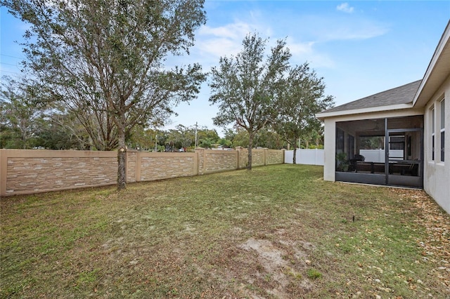 view of yard with a sunroom