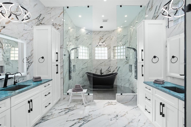 bathroom featuring tile walls, vanity, and a healthy amount of sunlight