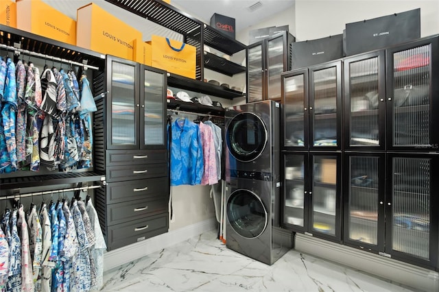 laundry room with stacked washer and dryer