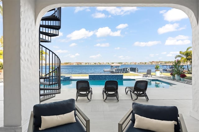 view of patio featuring a water view