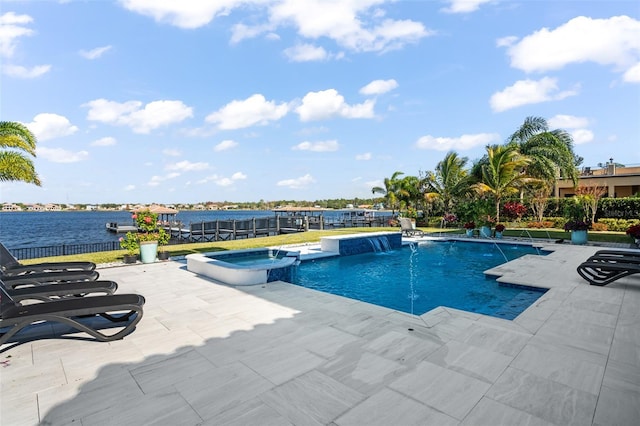 view of pool featuring a patio area, an in ground hot tub, pool water feature, and a water view