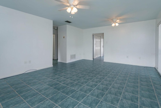 spare room with ceiling fan