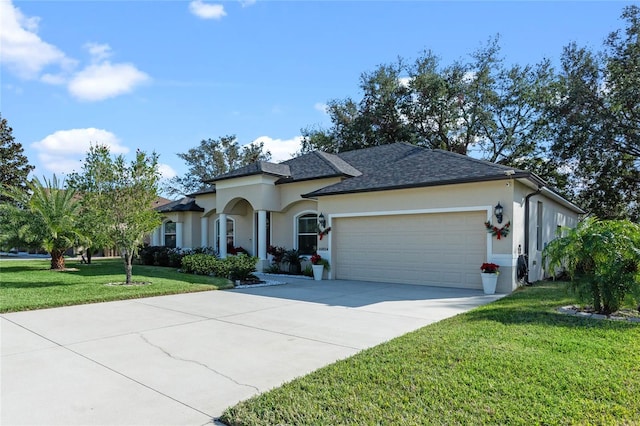 view of front of home featuring a front yard and a garage