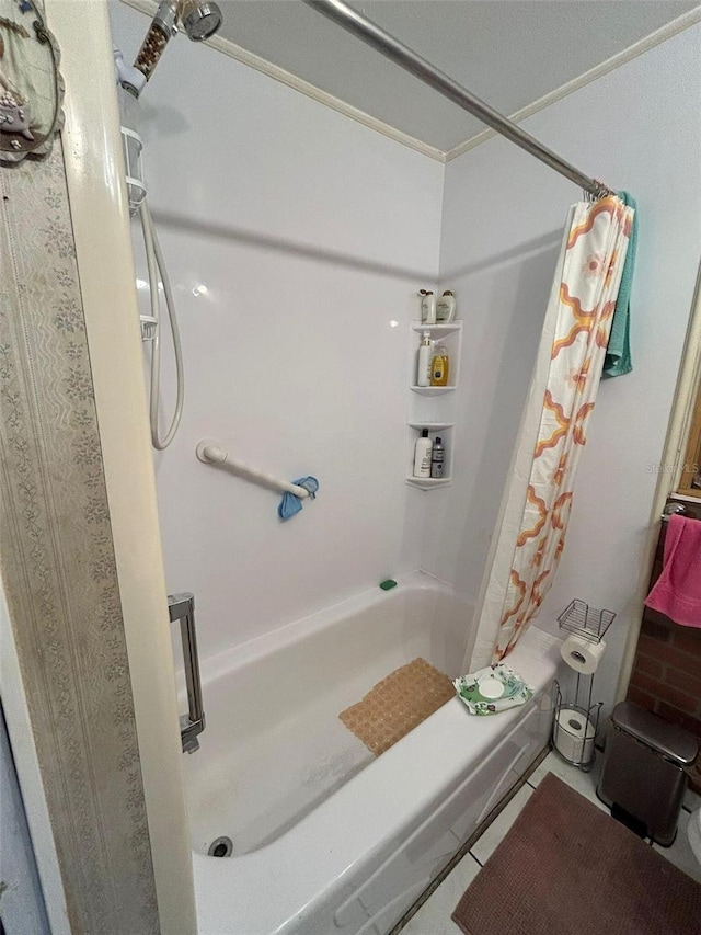 bathroom featuring tile patterned flooring and shower / tub combo