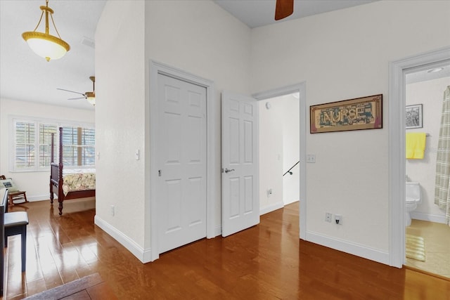 interior space with hardwood / wood-style floors and connected bathroom