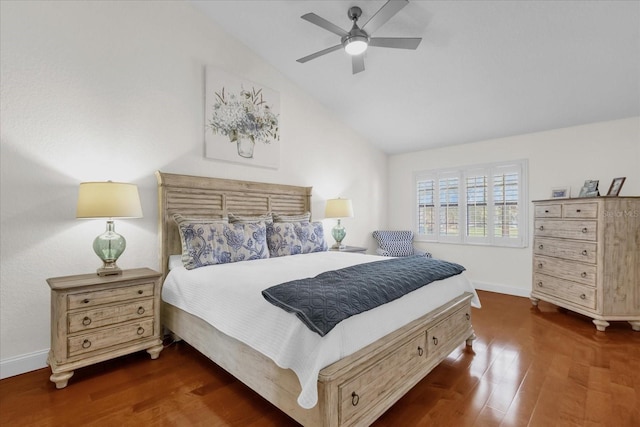 bedroom with dark hardwood / wood-style floors, vaulted ceiling, and ceiling fan