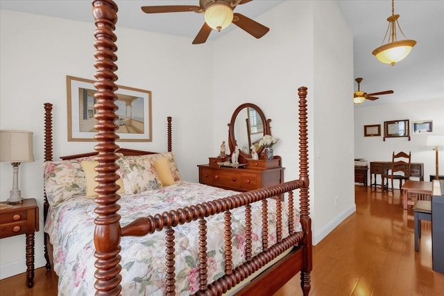 bedroom with ceiling fan and wood-type flooring