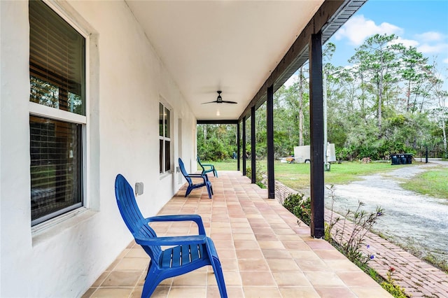 view of patio featuring ceiling fan