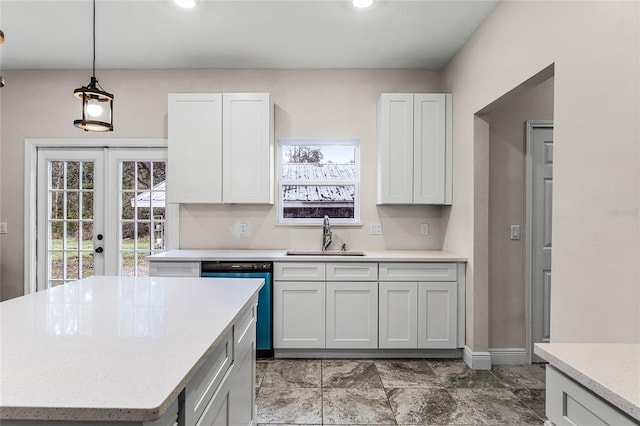 kitchen featuring white cabinets, dishwashing machine, sink, and french doors