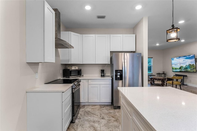 kitchen featuring pendant lighting, white cabinets, and stainless steel appliances