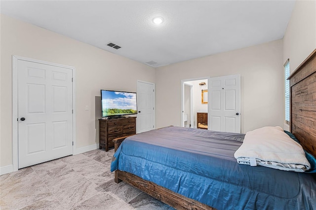 bedroom featuring ensuite bath