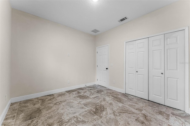 unfurnished bedroom with a closet