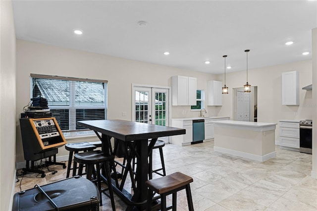 dining room featuring sink and french doors