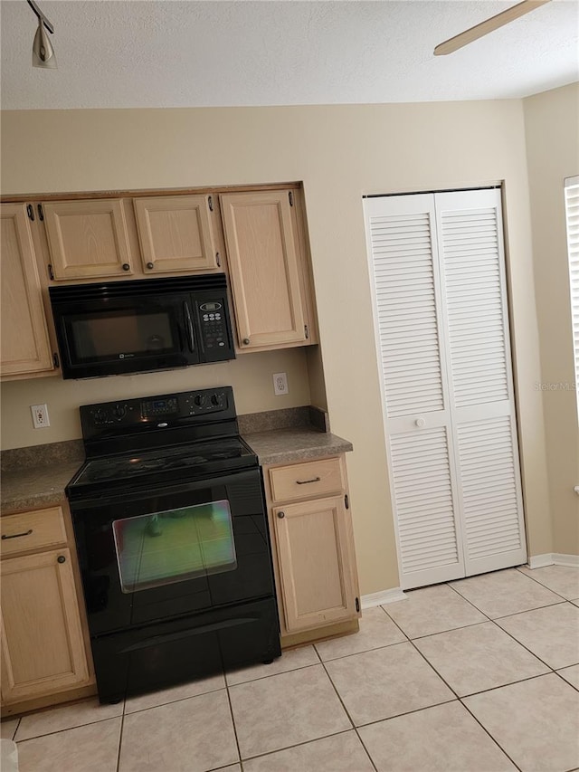 kitchen featuring black appliances, ceiling fan, light tile patterned flooring, and light brown cabinets