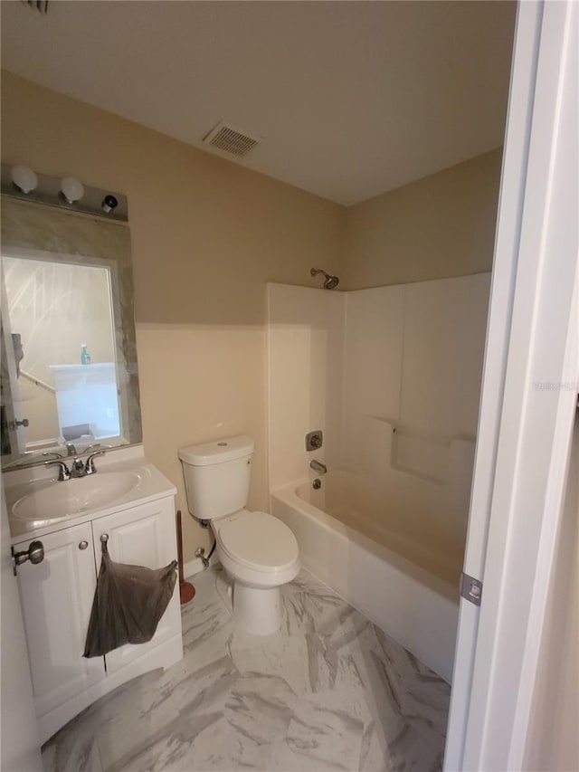 full bathroom featuring vanity, bathing tub / shower combination, and toilet