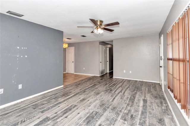 empty room featuring hardwood / wood-style flooring and ceiling fan