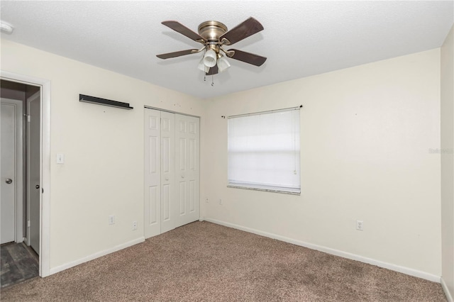 unfurnished bedroom with carpet and ceiling fan