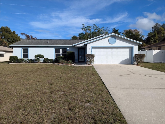 ranch-style home with a garage and a front yard