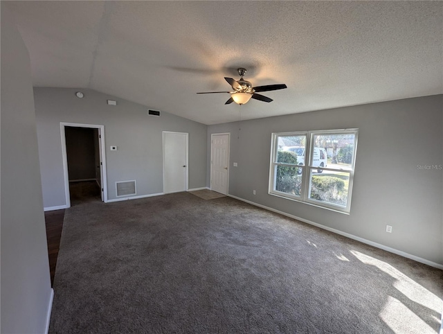 carpeted spare room with ceiling fan, a textured ceiling, and vaulted ceiling