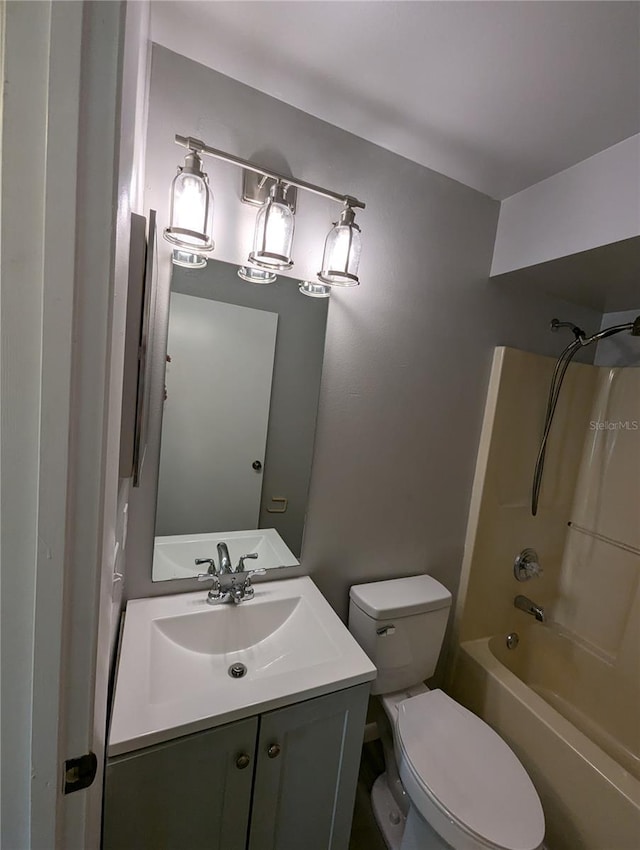 full bathroom featuring vanity, toilet, and bathing tub / shower combination