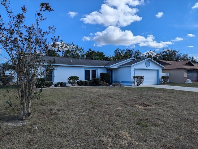 ranch-style house featuring a garage and a front lawn